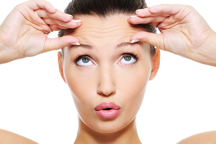 female face with wrinkles on her forehead female face with wrinkles on her forehead